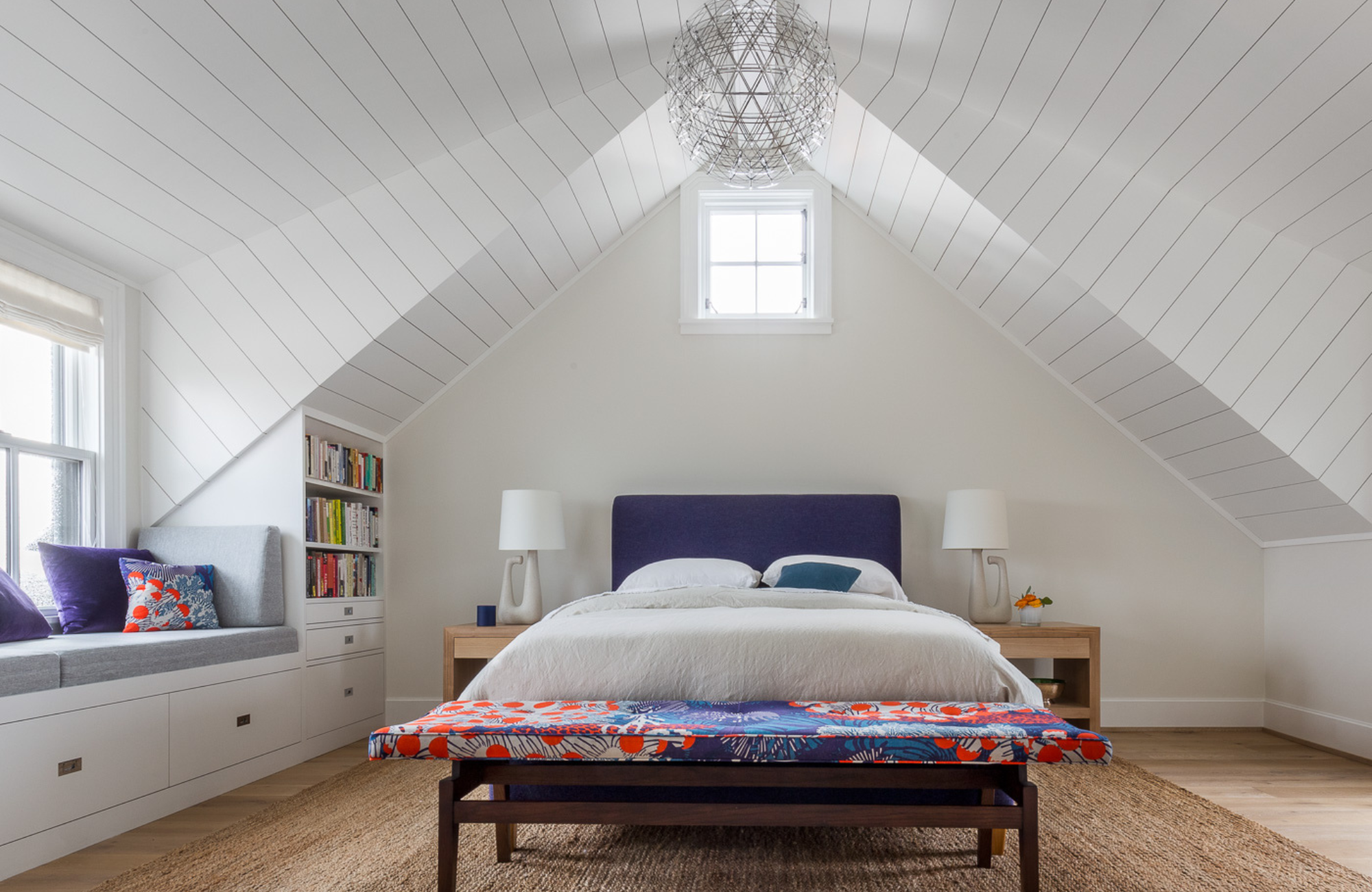 coddington-design-beach-inspired-bedroom-bay-area-interiors-shiplap-ceiling-timeless-chandelier-window-seat-colorful-bench